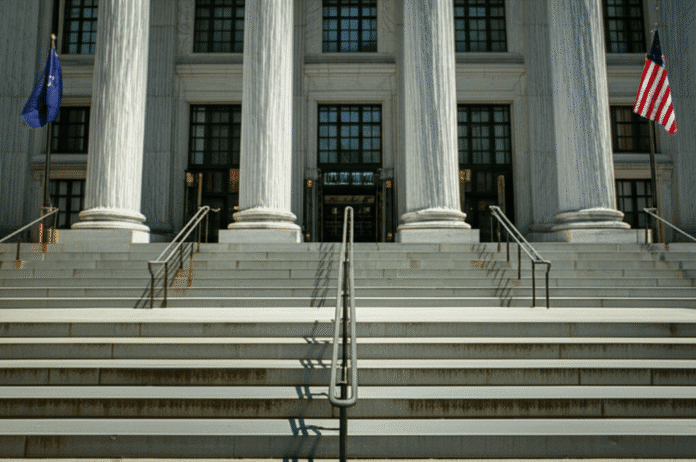 Southern District of New York federal courthouse entrance with dramatic lighting, emphasizing the gravity of the legal proceedings