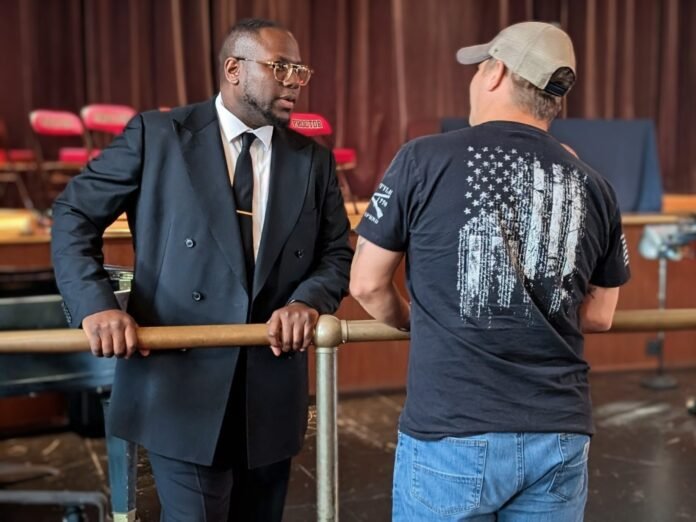 L to R; Dr. Christopher Spence at Town Hall Meeting with parent